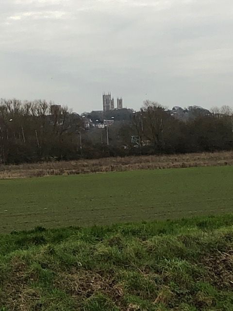 view across fields to Lincoln cathedral